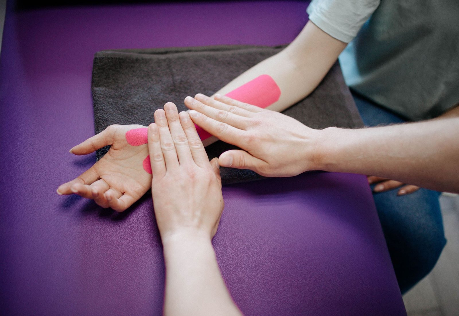 A physical therapist guiding a patient through a stretch